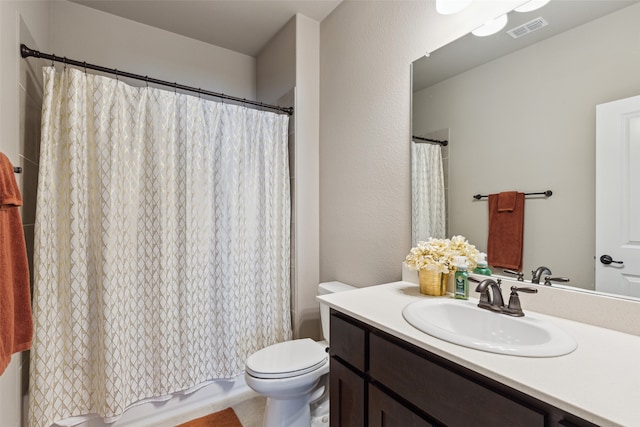 full bathroom with vanity, toilet, and shower / bath combination with curtain