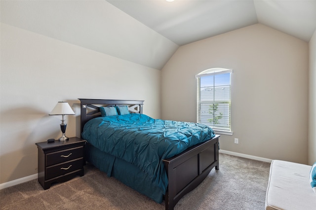 carpeted bedroom featuring vaulted ceiling