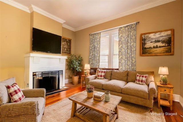 living room featuring hardwood / wood-style flooring and ornamental molding