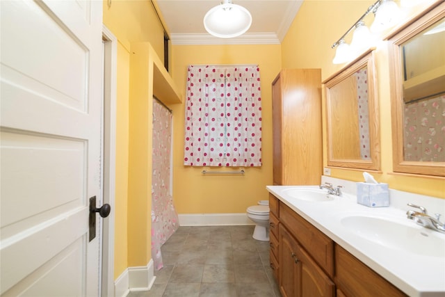 bathroom featuring vanity, toilet, and ornamental molding