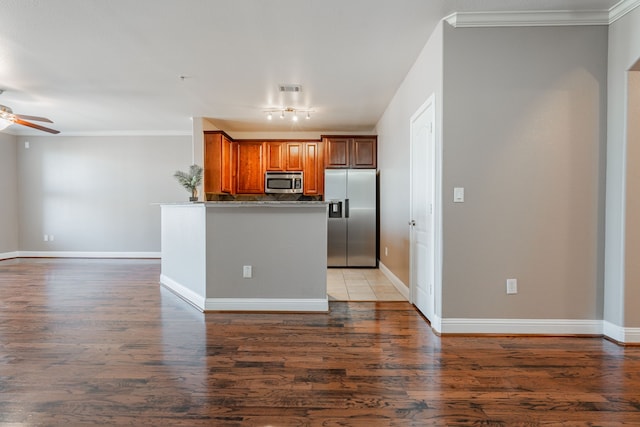 kitchen with ceiling fan, ornamental molding, stainless steel appliances, and dark hardwood / wood-style floors