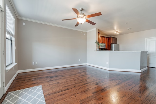 unfurnished living room with crown molding, ceiling fan, and dark hardwood / wood-style flooring