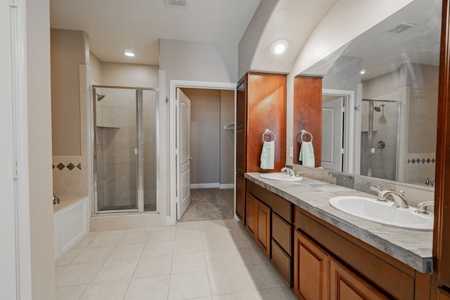 bathroom featuring tile patterned floors, separate shower and tub, and vanity