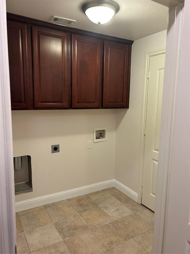 clothes washing area with hookup for a washing machine, hookup for an electric dryer, and cabinets