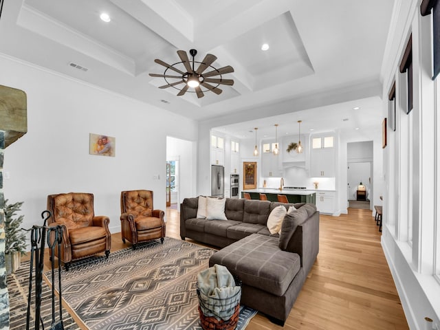 living room featuring visible vents, crown molding, beamed ceiling, light wood-style floors, and coffered ceiling