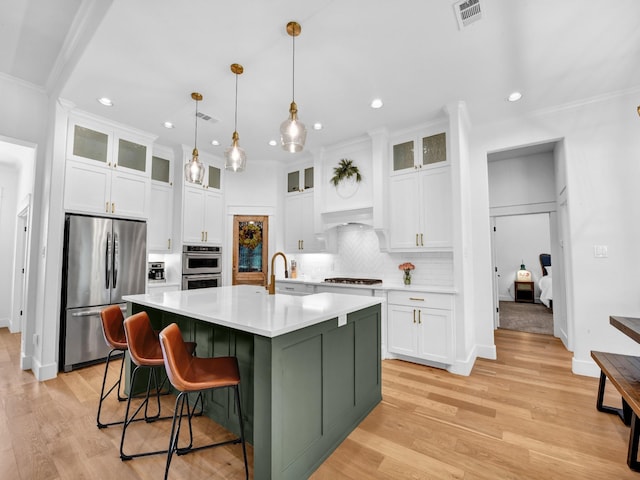 kitchen with white cabinetry, visible vents, and appliances with stainless steel finishes