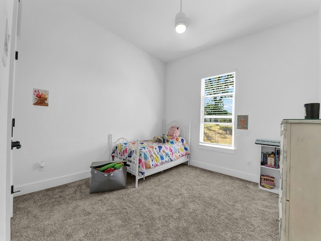 bedroom with baseboards and carpet floors