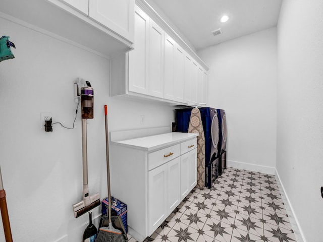 laundry room featuring washing machine and clothes dryer, baseboards, light floors, recessed lighting, and cabinet space