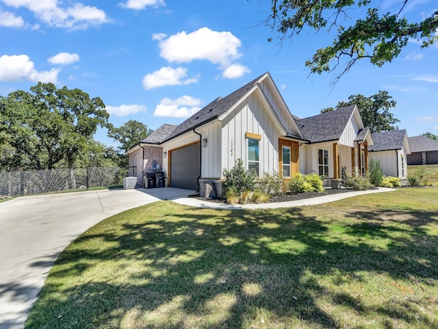 view of property exterior featuring a garage, a lawn, concrete driveway, and fence