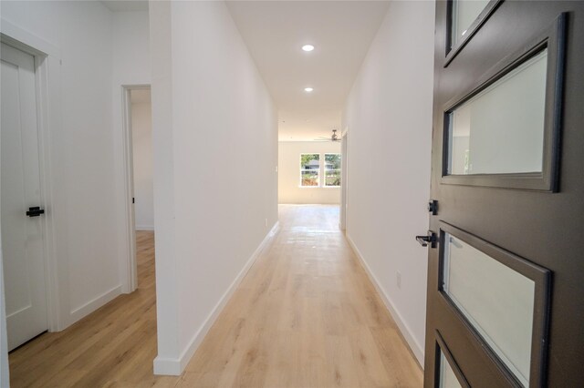 unfurnished bedroom featuring light wood-type flooring and a closet