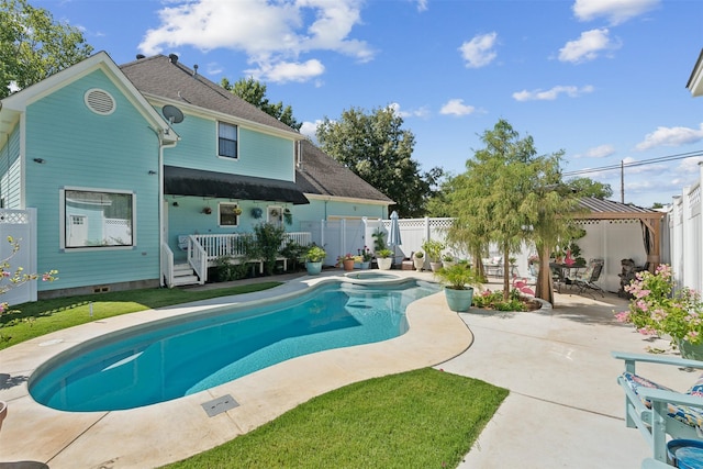 view of swimming pool with a patio area