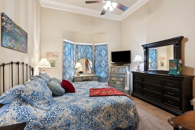 carpeted bedroom featuring ceiling fan and ornamental molding