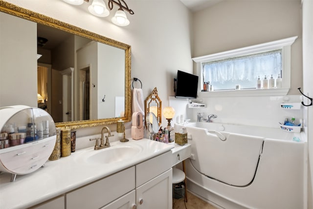 bathroom featuring vanity and a bath