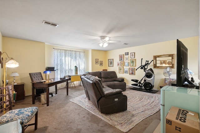 living room featuring carpet flooring and ceiling fan