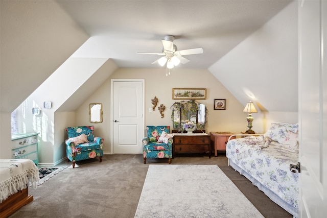 bedroom featuring ceiling fan, dark carpet, and lofted ceiling