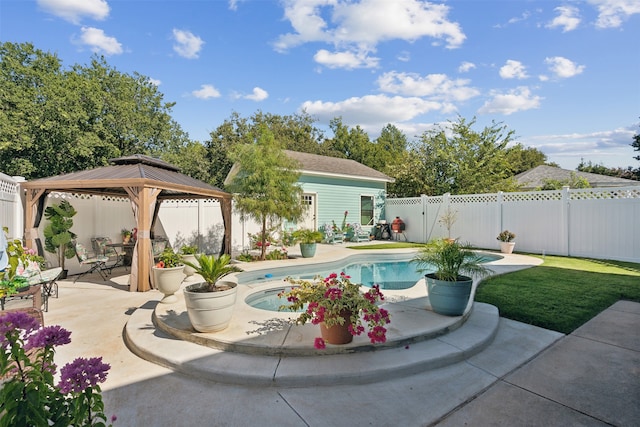 view of swimming pool featuring a gazebo and a patio