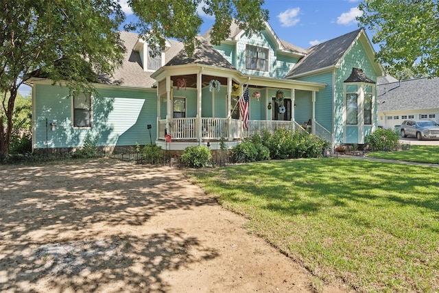 view of front of property with a porch and a front lawn