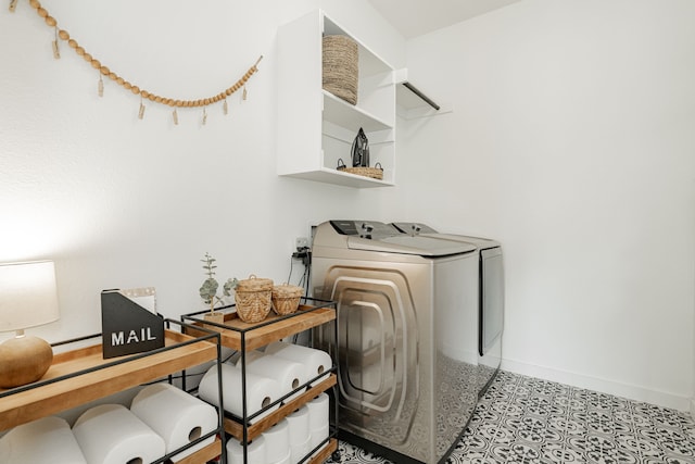 clothes washing area featuring washer and dryer