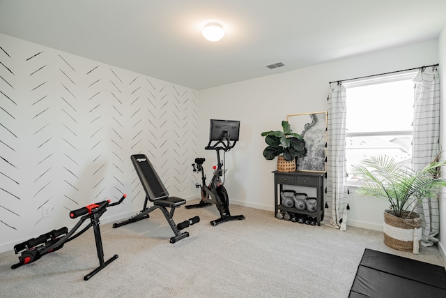 workout room with light colored carpet