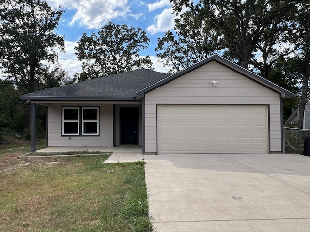 single story home with a front lawn and a garage