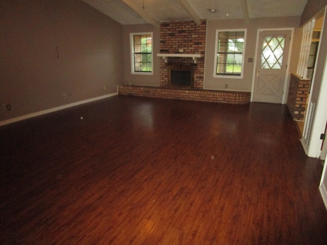 unfurnished living room with a fireplace and dark hardwood / wood-style flooring