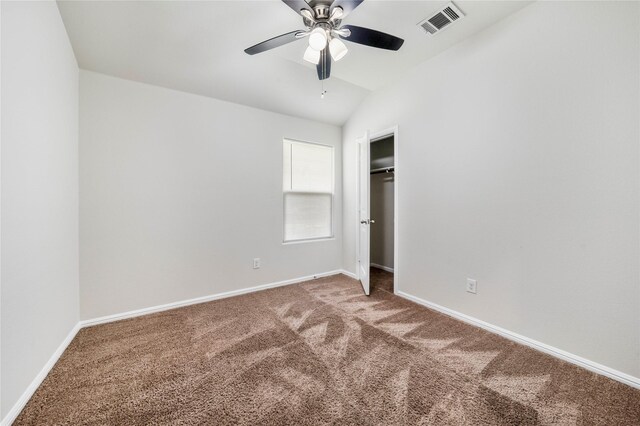 unfurnished bedroom featuring ceiling fan and carpet floors