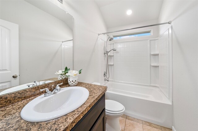 carpeted spare room with ceiling fan and vaulted ceiling