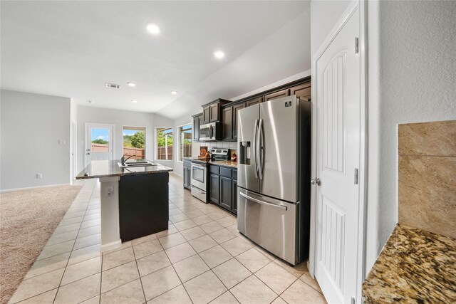 kitchen with backsplash, stainless steel fridge with ice dispenser, light tile patterned floors, and light stone counters