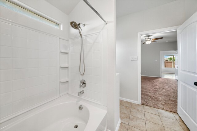 spacious closet with light colored carpet, built in desk, sink, and vaulted ceiling