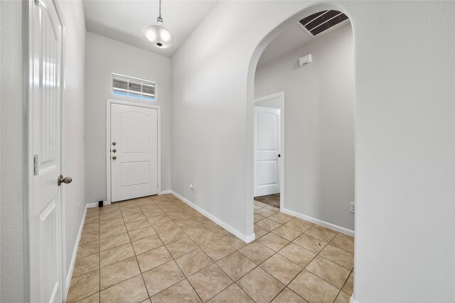 carpeted empty room with ceiling fan and vaulted ceiling