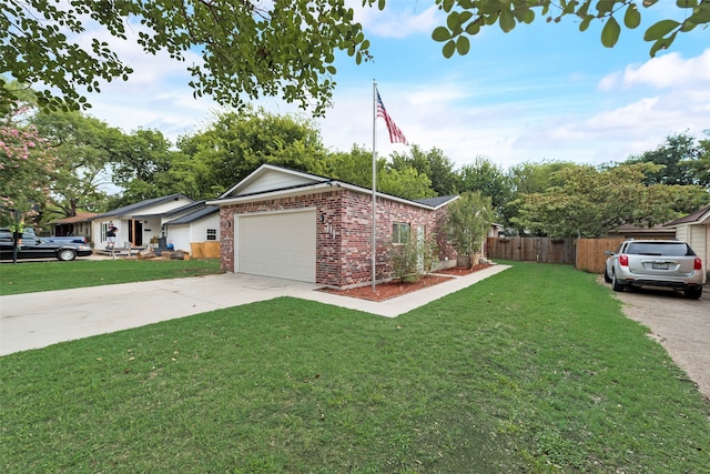 view of front of house featuring a front yard and a garage