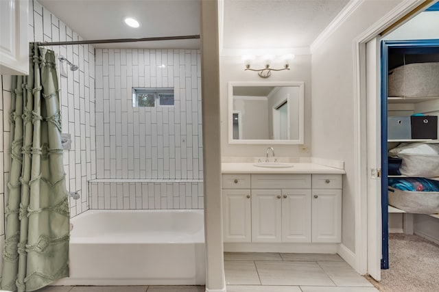 bathroom with vanity, shower / bath combination with curtain, and crown molding