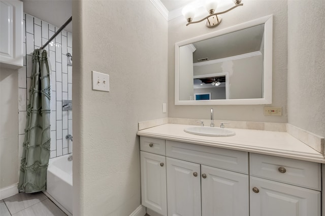 bathroom featuring crown molding, shower / bath combo, and vanity