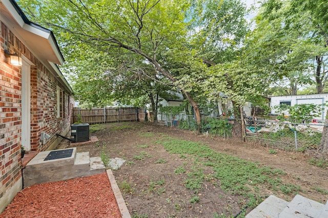 view of yard with central AC