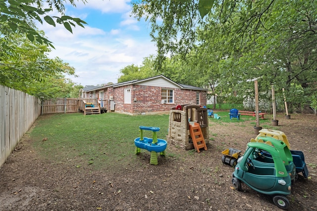 exterior space with a deck and a playground