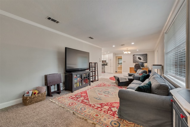 living room featuring an inviting chandelier, ornamental molding, and carpet