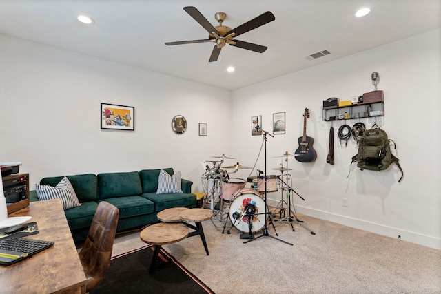 living room featuring ceiling fan and carpet