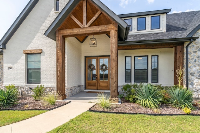 view of exterior entry featuring covered porch