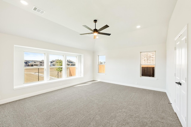 spare room featuring carpet floors, ceiling fan, and lofted ceiling