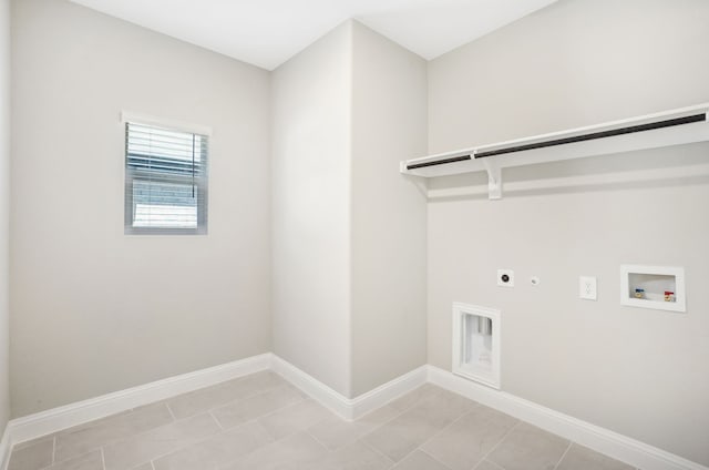 washroom featuring hookup for a washing machine, hookup for a gas dryer, light tile patterned floors, and electric dryer hookup