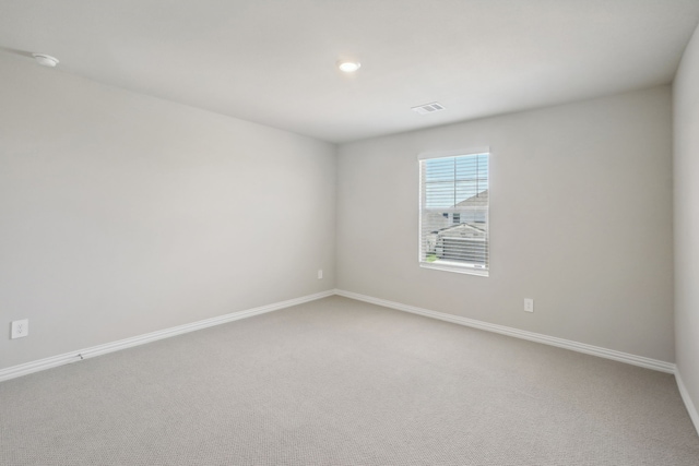 unfurnished room with carpet flooring