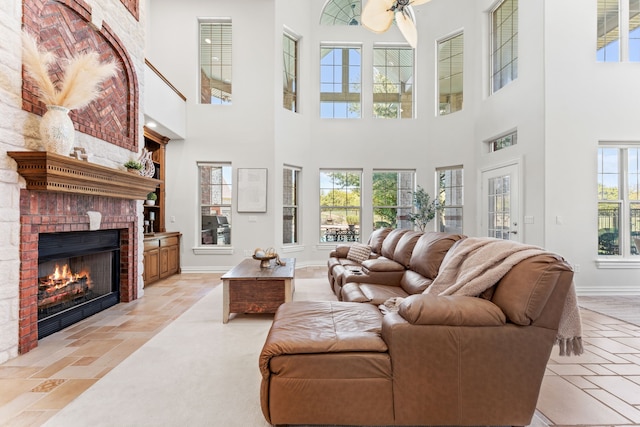 living room with a brick fireplace