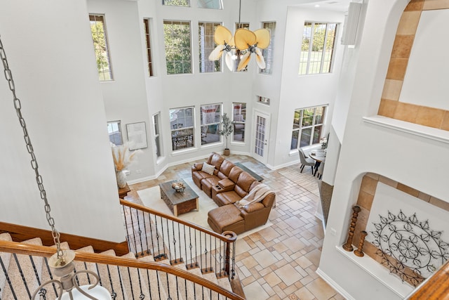 living room with a towering ceiling