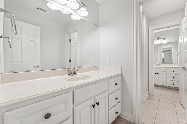 bathroom with vanity and tile patterned floors