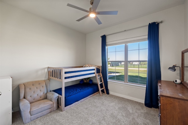 bedroom with ceiling fan and carpet floors