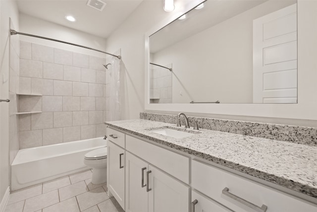 full bathroom featuring vanity, toilet, tile patterned flooring, and shower / bath combo with shower curtain