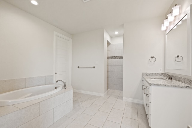 bathroom featuring vanity, tile patterned flooring, and shower with separate bathtub