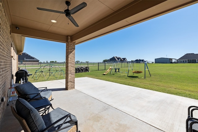 view of patio / terrace with a playground and ceiling fan