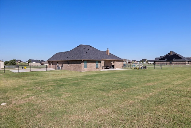 view of yard with a playground and a patio area