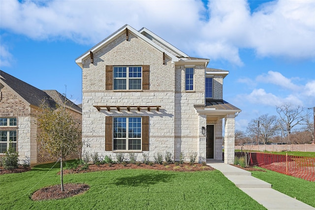 view of front facade featuring a front yard